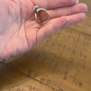 Real 10k gold diamond ring. The ring is bent but can easily be corrected.